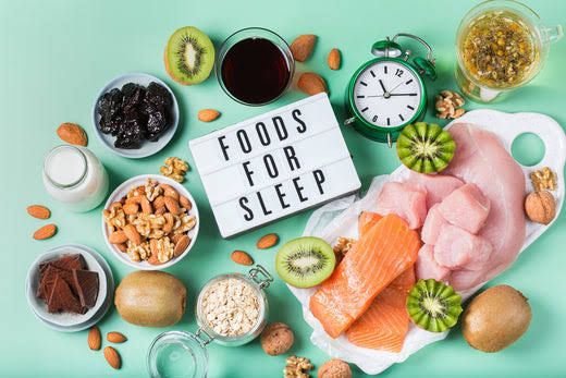 An assortment of nutrient-dense foods that help you sleep, including nuts, seeds, and berries