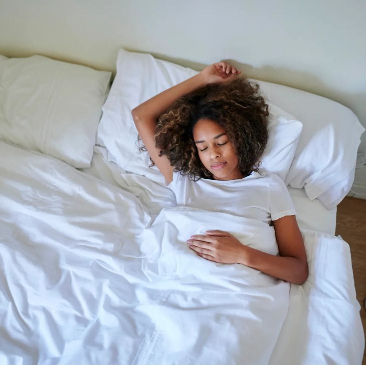 sleeping facing up on a comfortable mattress with head elevated