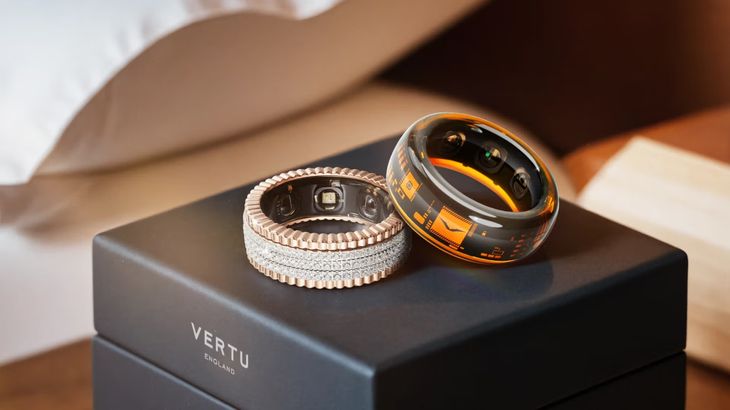 Collection of modern smart rings on wooden background