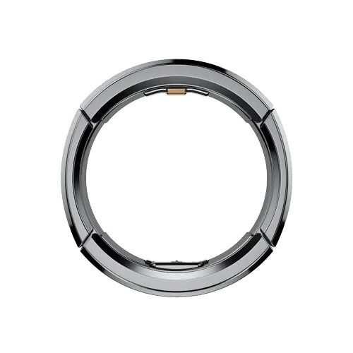 Multiple elegant smart rings shown in silver, gold, and black finishes on a rustic surface