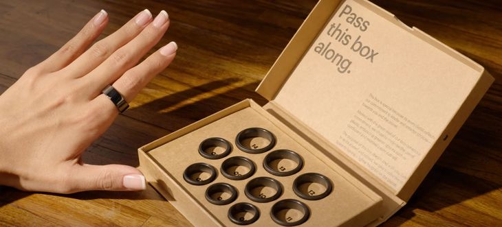 Ultrahuman and modern smart ring sizing kits laid out on a table