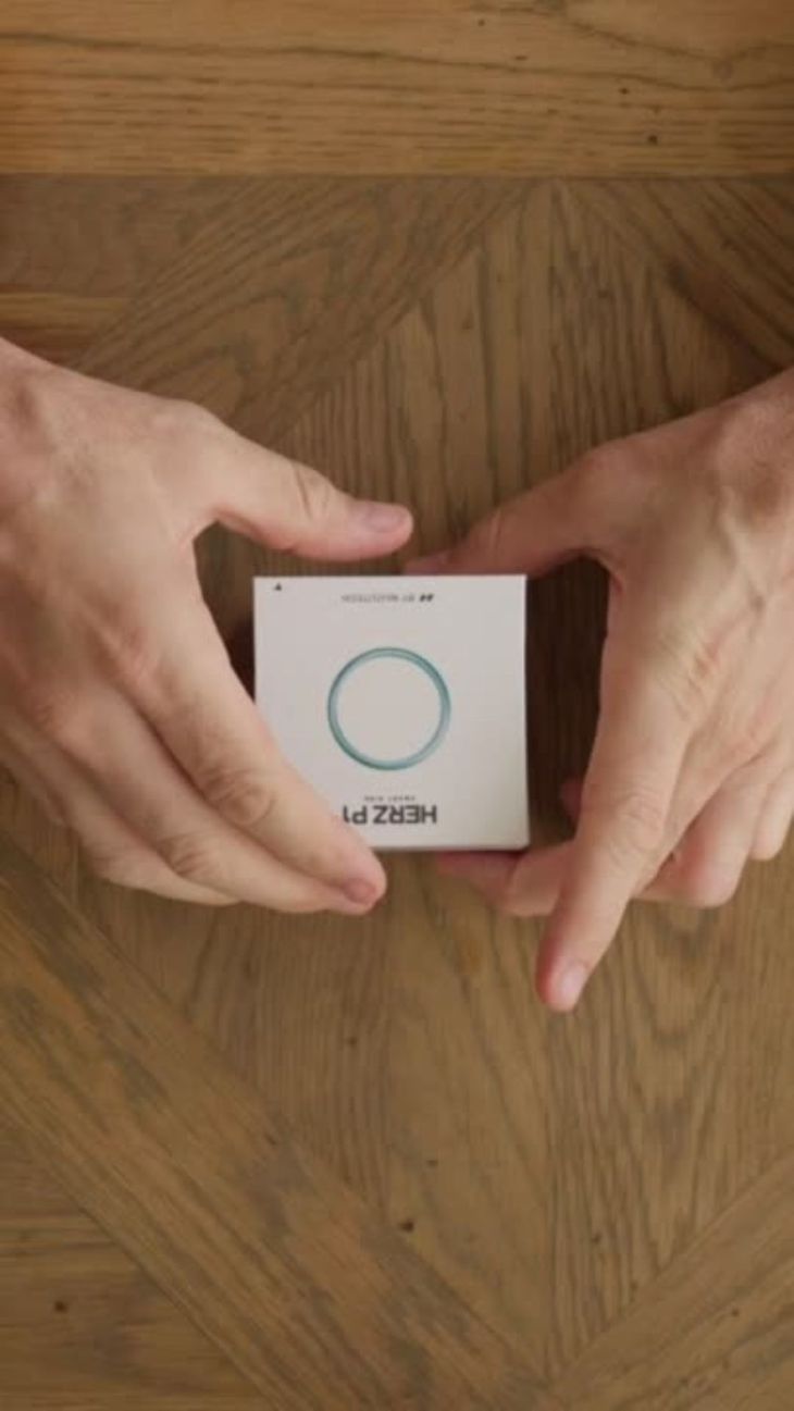 Herz P1 Smart Ring unboxing experience showing premium minimalist packaging and accessories